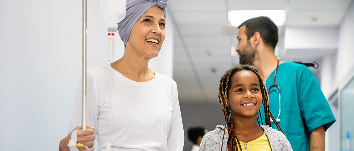 cancer patient with her daughter and doctor in the corridor
